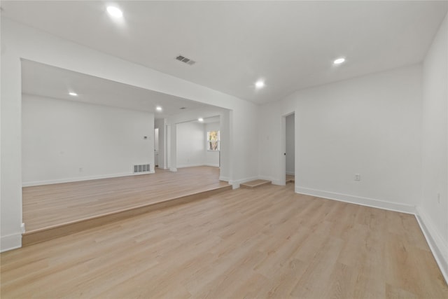 spare room with light hardwood / wood-style flooring