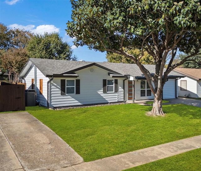 view of front of property featuring cooling unit and a front yard