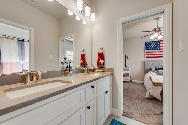 bathroom with ceiling fan and vanity