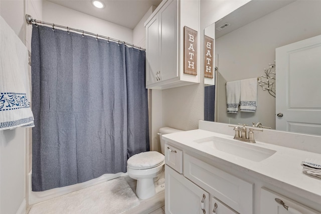 bathroom featuring toilet and vanity