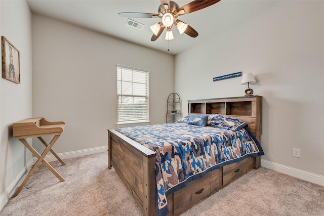 bedroom featuring ceiling fan and light carpet