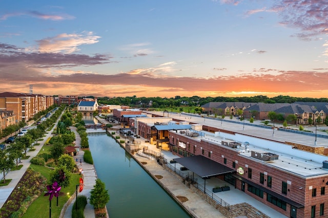 aerial view at dusk with a water view