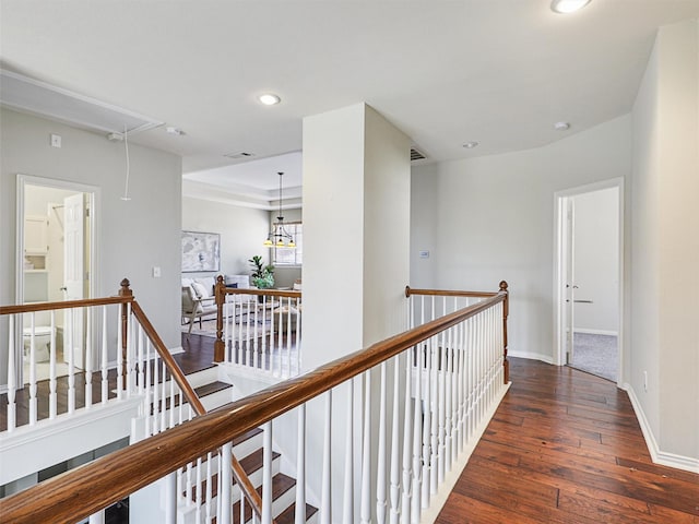 corridor with dark hardwood / wood-style floors