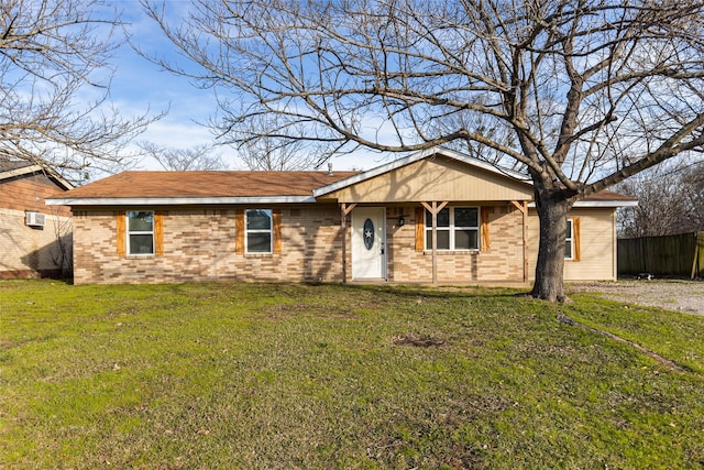 ranch-style house featuring a front lawn