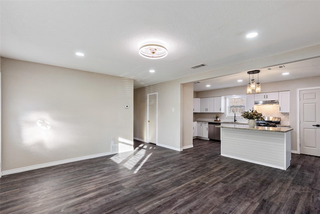 kitchen with dark wood-type flooring, a center island, hanging light fixtures, stainless steel appliances, and white cabinetry