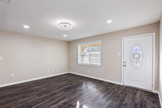 foyer with dark hardwood / wood-style flooring