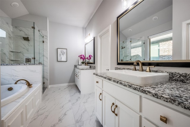 bathroom featuring vaulted ceiling, separate shower and tub, and vanity