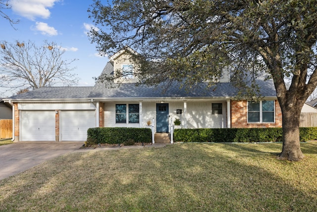 view of front of property with a front yard and a garage