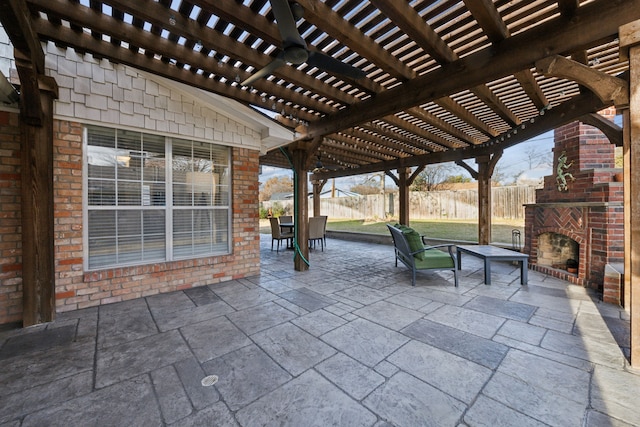 view of patio / terrace with an outdoor brick fireplace and a pergola