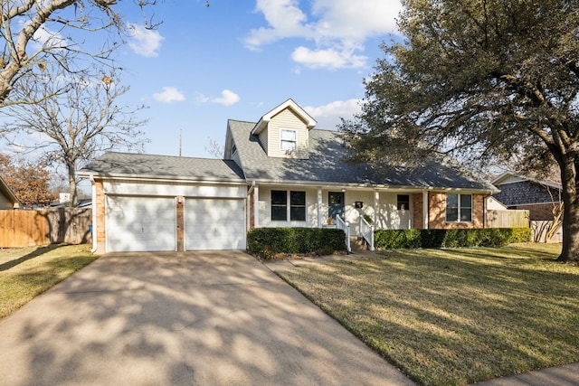 view of front of home featuring a front yard and a garage