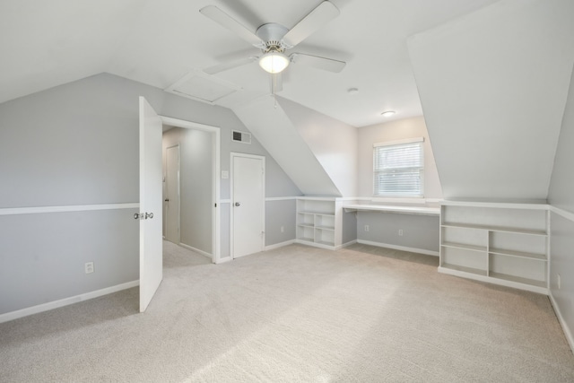 bonus room with ceiling fan, light colored carpet, and lofted ceiling