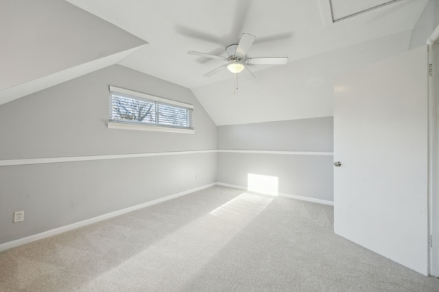 bonus room featuring ceiling fan, vaulted ceiling, and carpet