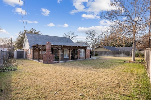 rear view of house with a storage unit and a yard