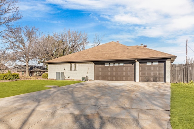 view of property exterior with central AC unit and a lawn