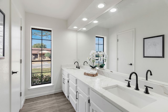 bathroom featuring hardwood / wood-style flooring and vanity