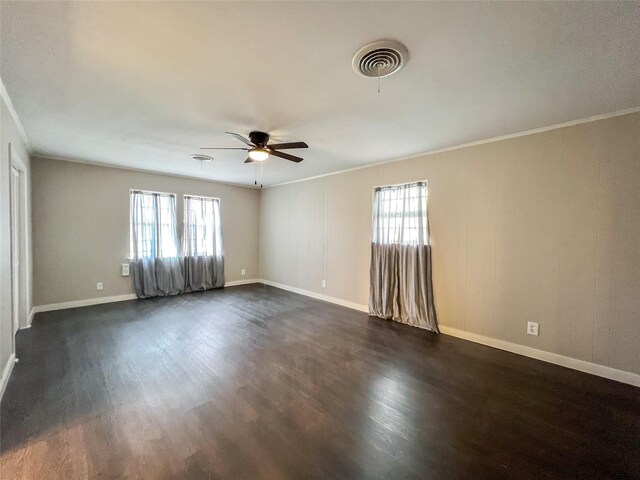 unfurnished room with ceiling fan, dark hardwood / wood-style flooring, and crown molding