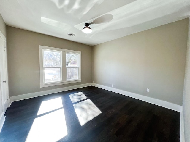 empty room featuring dark hardwood / wood-style floors