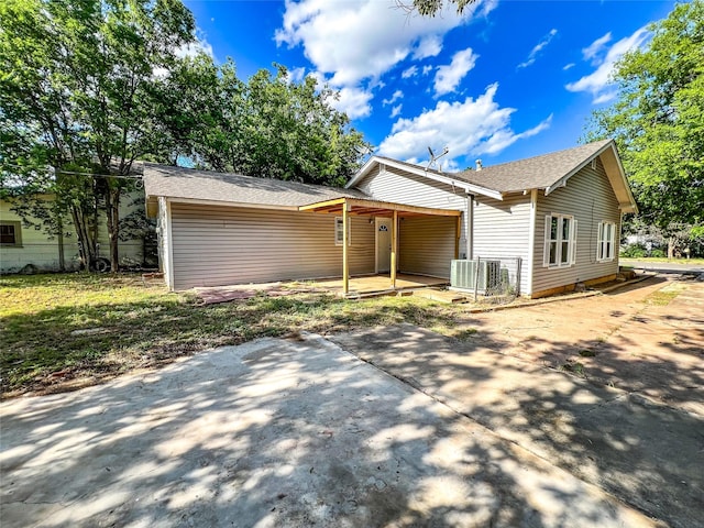 ranch-style home with central air condition unit