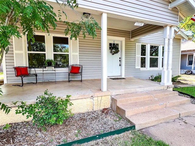 entrance to property with a porch