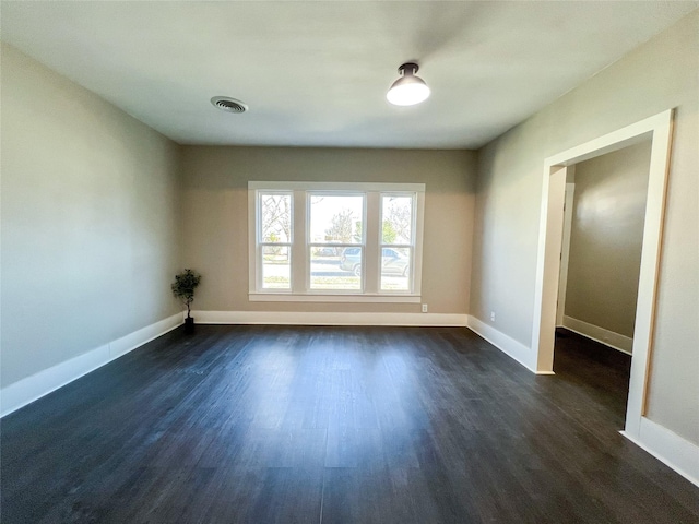 empty room featuring dark hardwood / wood-style floors