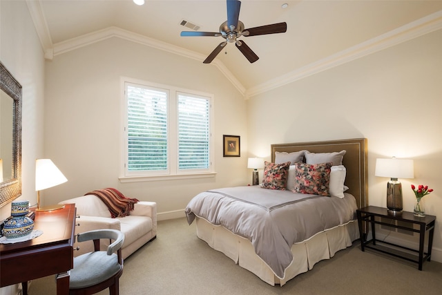 carpeted bedroom featuring ceiling fan, vaulted ceiling, and crown molding