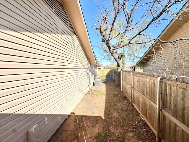 view of side of property with central AC