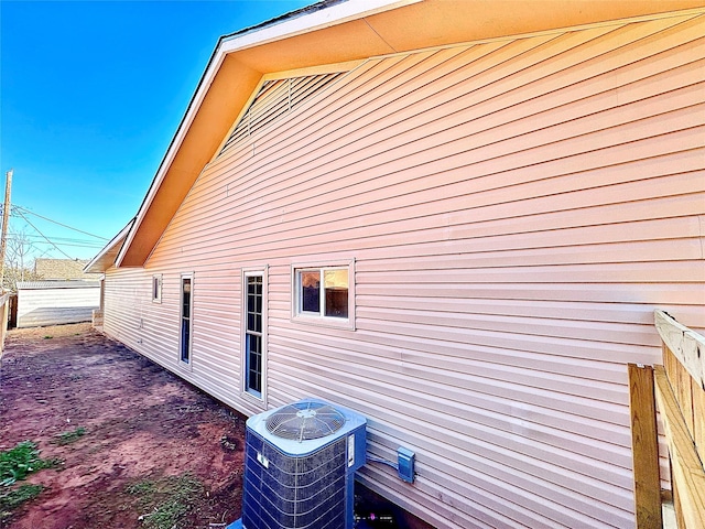 view of side of home featuring central AC unit