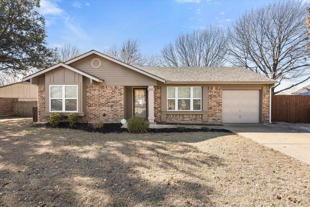 single story home featuring a garage