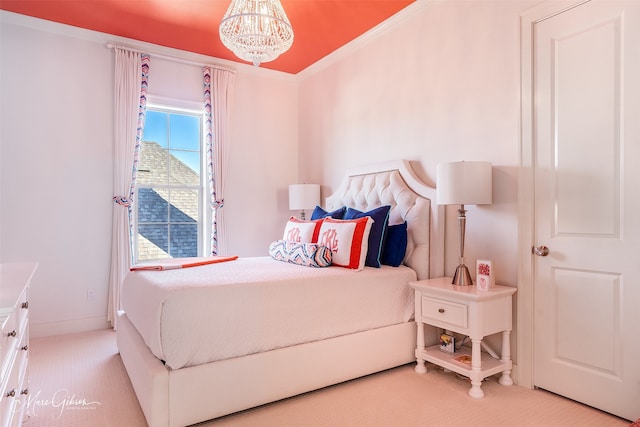 bedroom featuring ornamental molding and a chandelier