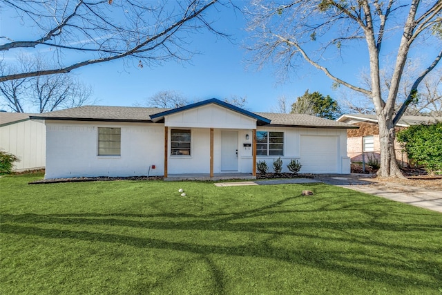 ranch-style house featuring driveway, an attached garage, a shingled roof, and a front yard