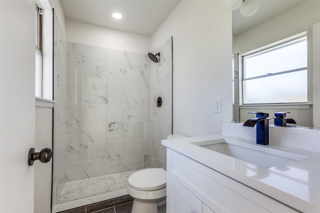 bathroom featuring a stall shower, vanity, toilet, and recessed lighting