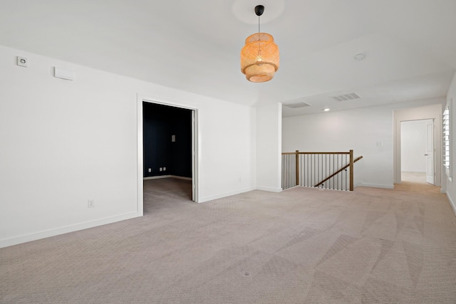 unfurnished room with light colored carpet