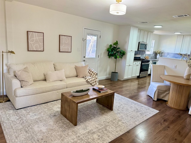 living room with light hardwood / wood-style floors