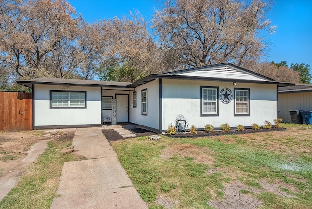 ranch-style house with a front lawn