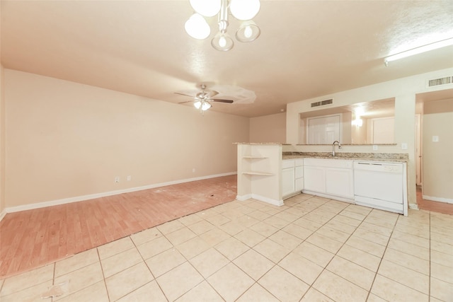 kitchen featuring kitchen peninsula, dishwasher, white cabinetry, ceiling fan, and sink