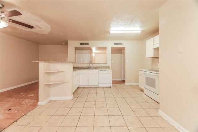 kitchen with white appliances, kitchen peninsula, a textured ceiling, sink, and white cabinetry