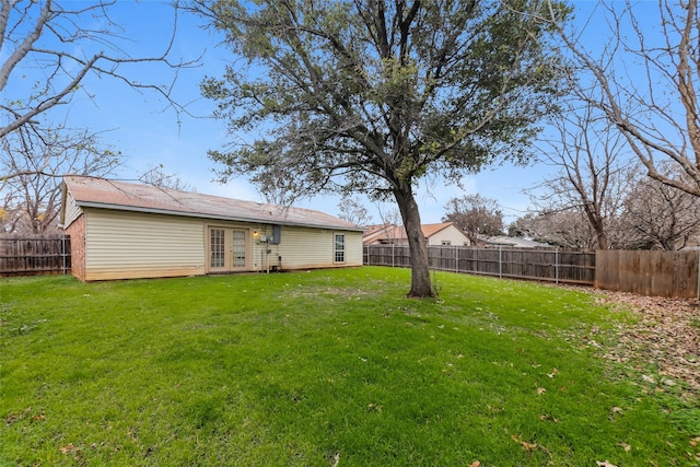 view of yard with french doors