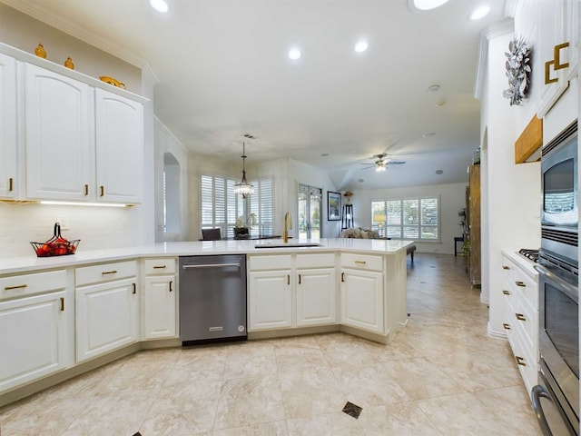 kitchen featuring pendant lighting, white cabinets, appliances with stainless steel finishes, ceiling fan, and sink