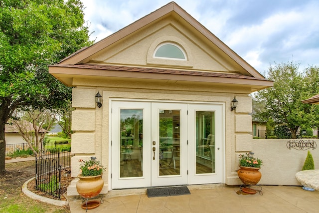 doorway to property featuring french doors