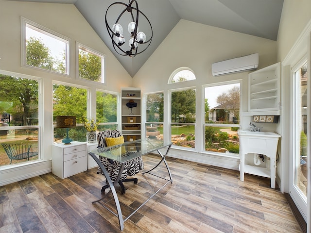 sunroom / solarium featuring an inviting chandelier, vaulted ceiling, and a wall unit AC