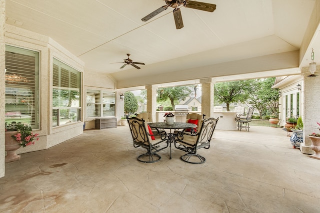 view of patio with an outdoor bar, grilling area, and ceiling fan