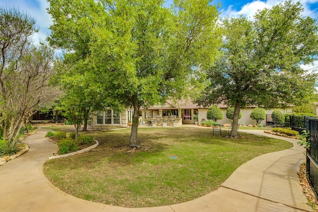 view of community featuring a lawn