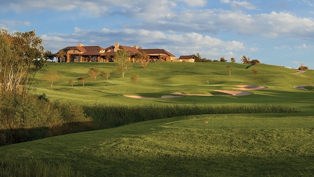 view of property's community with a lawn