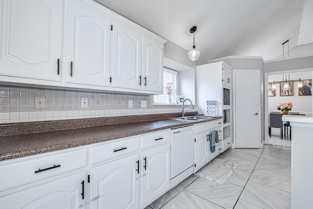 kitchen featuring white dishwasher, white cabinets, lofted ceiling, and sink