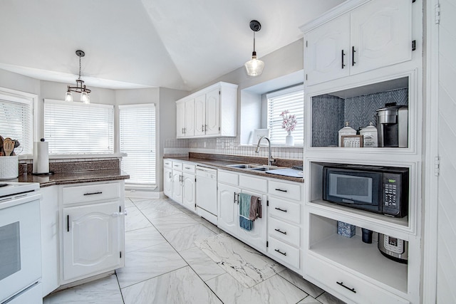 kitchen featuring white appliances, white cabinetry, lofted ceiling, and sink