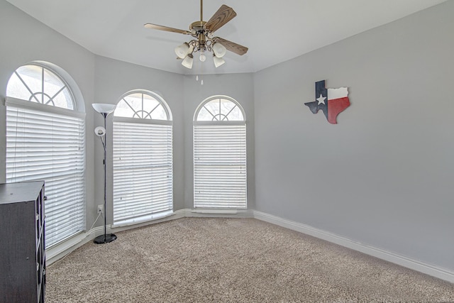 unfurnished room with ceiling fan, carpet, and plenty of natural light