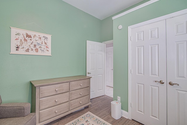 bedroom featuring a closet and light hardwood / wood-style floors