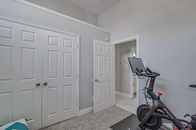 exercise area featuring light colored carpet