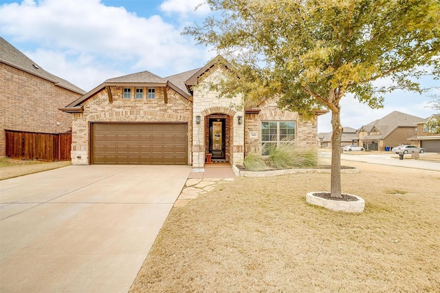 view of front of property featuring a garage and a front yard