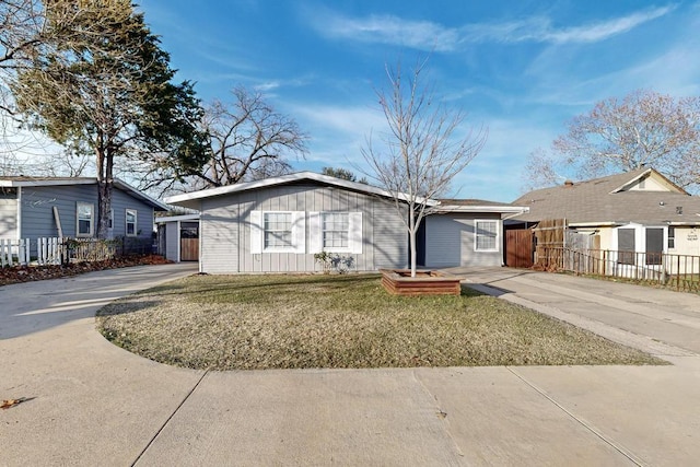 ranch-style home with a front lawn